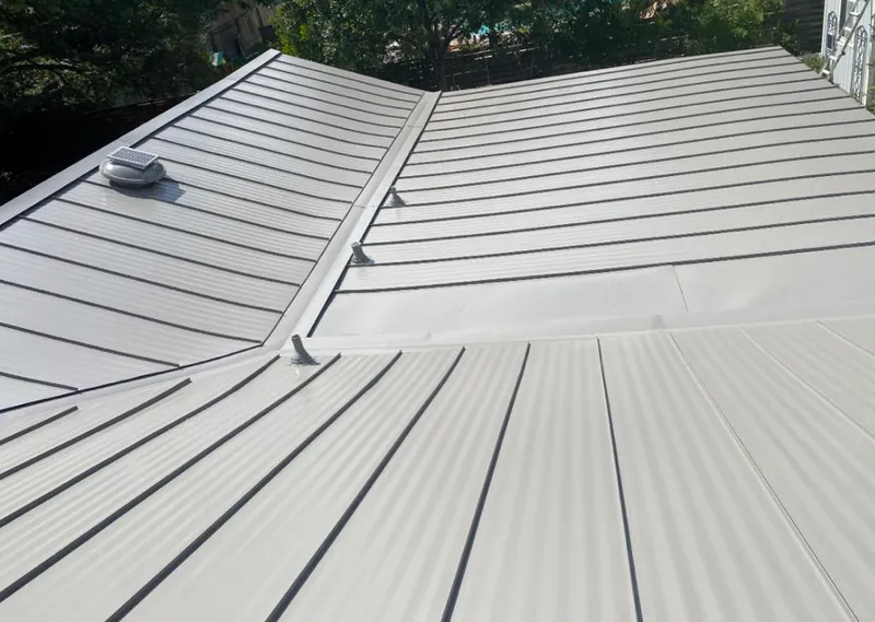 Solar attic fan installed on a metal roof for Roof Ventilation in Elizabeth City